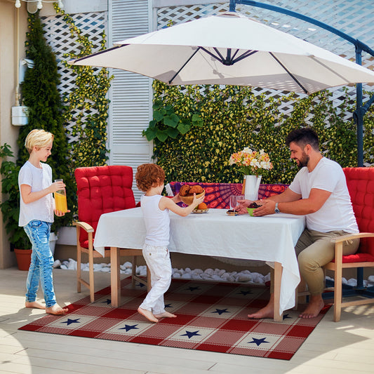 Wooden bench with American flag pillow and plaid rug on wooden floor