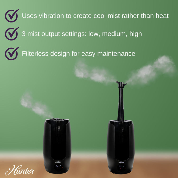 Black humidifier with steam release on a green background, featuring Hunter brand.