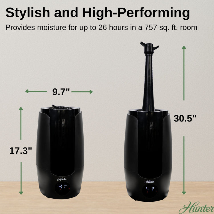 Black humidifier with dimensions labeled on a wooden surface and light gray background