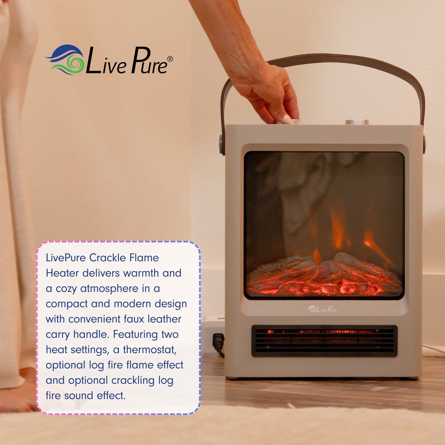 LivePure crackle flame heater with a hand holding it, displaying warm glow inside.