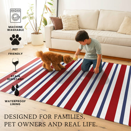 Wooden bench with decorative pillows on a porch featuring a red, white, and blue striped rug.