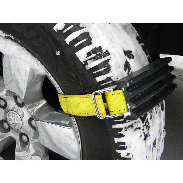 Tire with a snow chain attached on a snowy surface