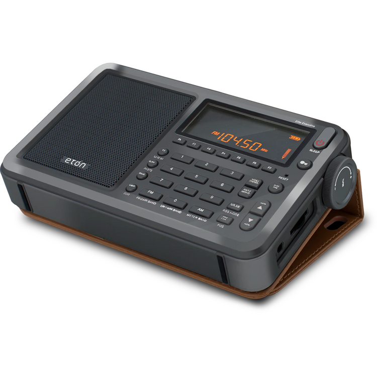 Black and brown radio with digital display on a white background