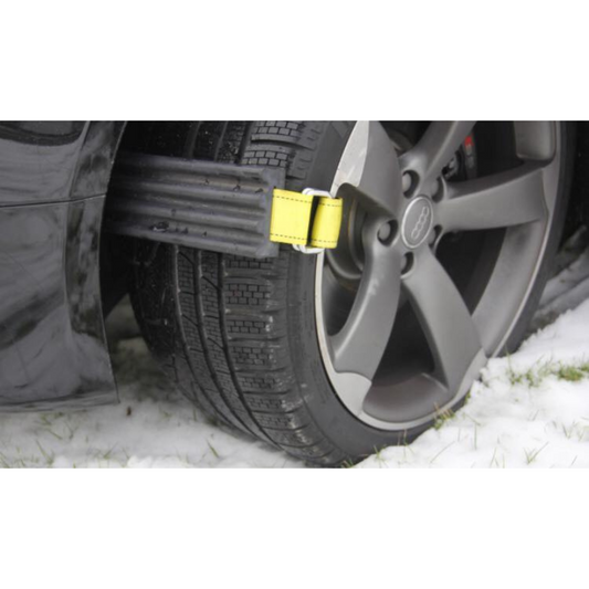 Tire carrier system with tires, straps, and a green bag on a white background