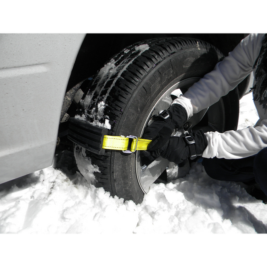 Tire carrier system with tires, straps, and a green bag on a white background