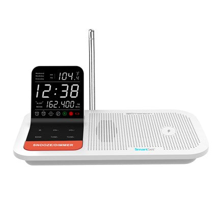 White digital clock radio with display and control buttons on a white background