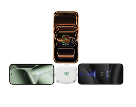 Four small electronic trackers in different colors (gray, mint green, pink, and white) lined up in a row against a plain white background.
